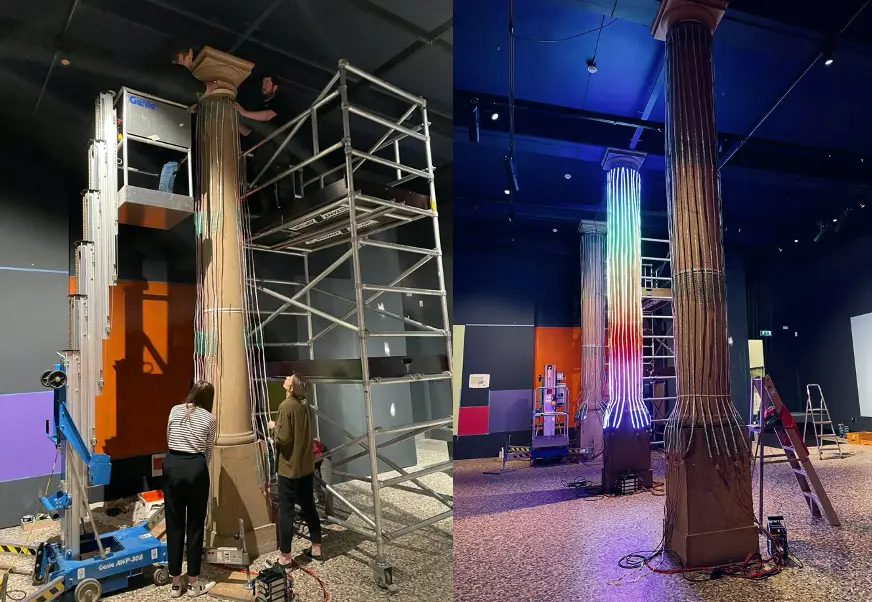 Museum team installing LED strips